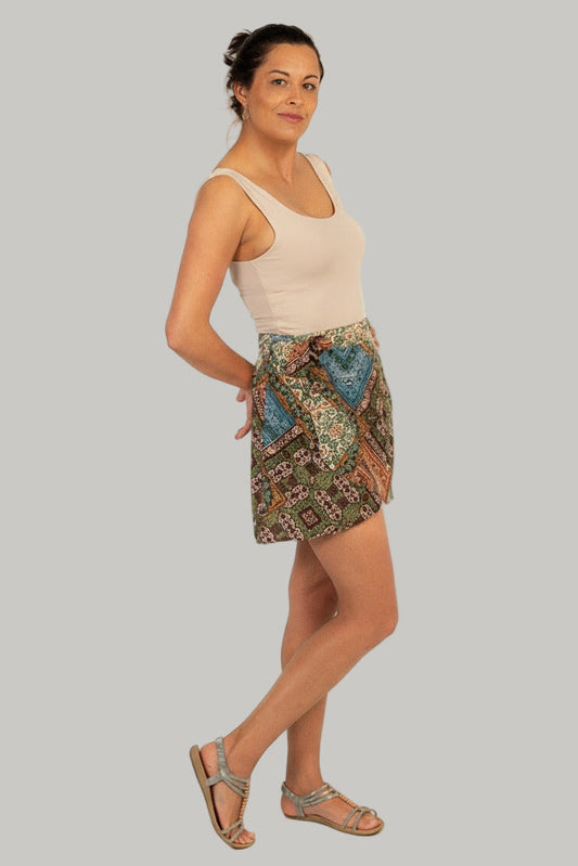 Woman wearing a patterned skirt on a white background
